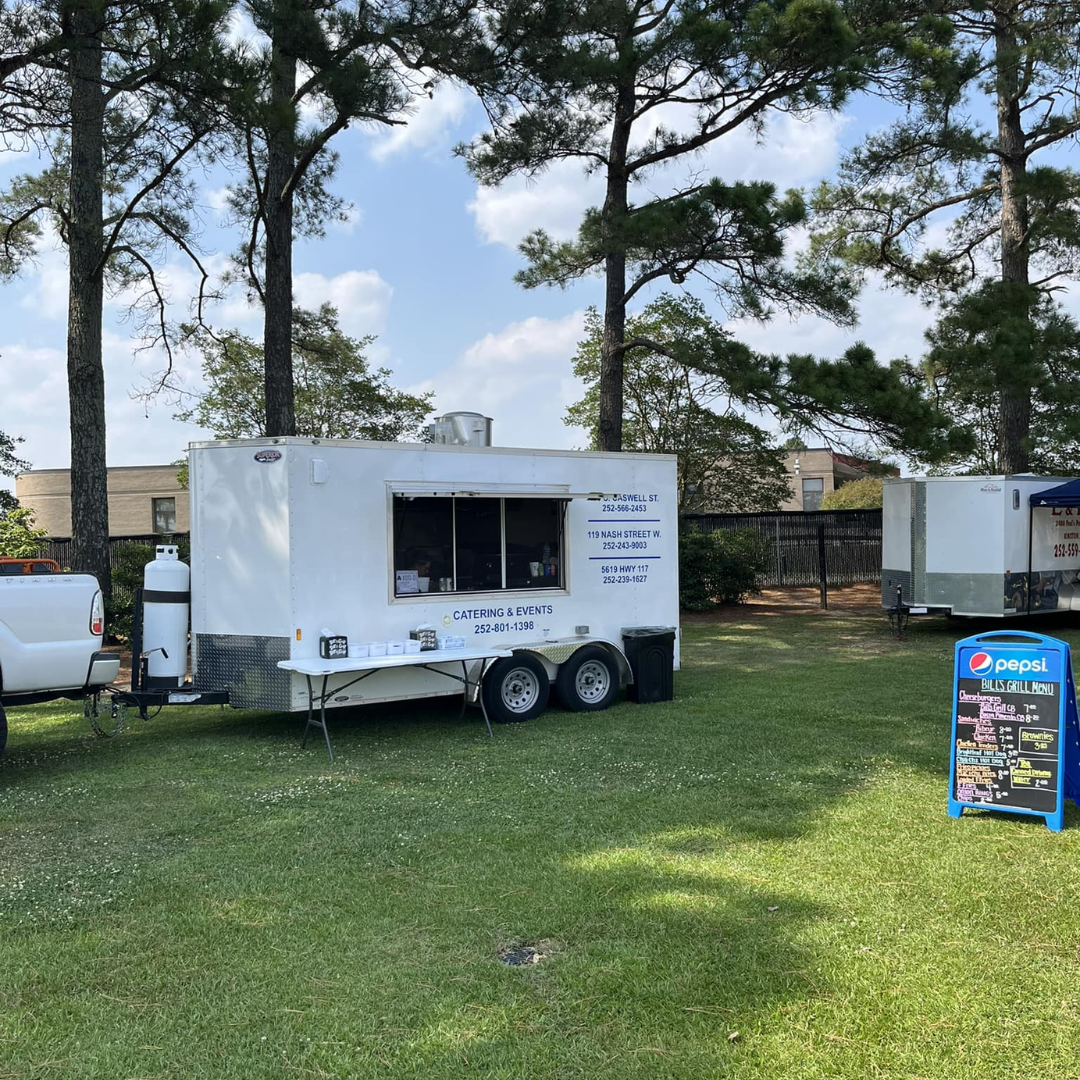 Bill's Grill food trailer serving a variety of delicious meals to customers