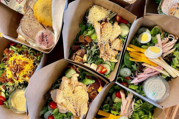 Custom corporate lunch menu with boxed meals, salads, and fresh drinks.