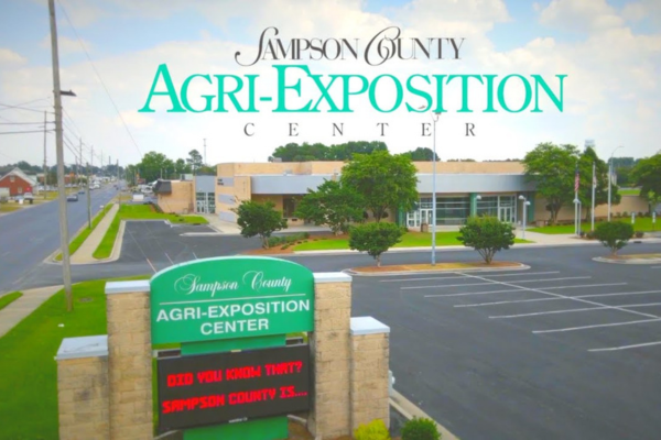 Exterior of the Sampson Agricultural Center in Clinton NC with landscaped entrance